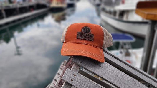 Orange trucker hat with leather patch